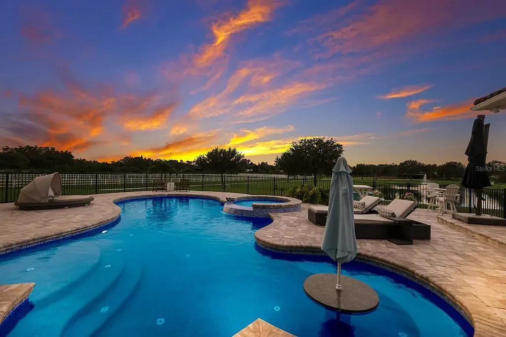 5952 Vanderipe Road Home in Sarasota, Florida. Discover luxurious country living at its finest in this custom-designed home nestled on a sprawling equestrian estate in Myakka Valley Ranches. With over 12 acres of land, two separate lots, and a meticulously crafted residence boasting modern amenities, this property offers a canvas for your dreams to flourish.