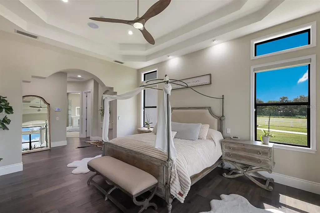 5952 Vanderipe Road Home in Sarasota, Florida. Discover luxurious country living at its finest in this custom-designed home nestled on a sprawling equestrian estate in Myakka Valley Ranches. With over 12 acres of land, two separate lots, and a meticulously crafted residence boasting modern amenities, this property offers a canvas for your dreams to flourish.