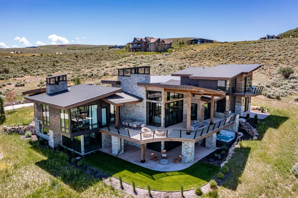 6110 E Blue Wing Loop Home in Kamas, Utah. Immerse yourself in the grandeur of Utah's natural beauty at 6110 E Blue Wing in Victory Ranch. This modern mountain home offers breathtaking 180° views of mountains, Deer Valley ski resort, and rock cliffs from every room.