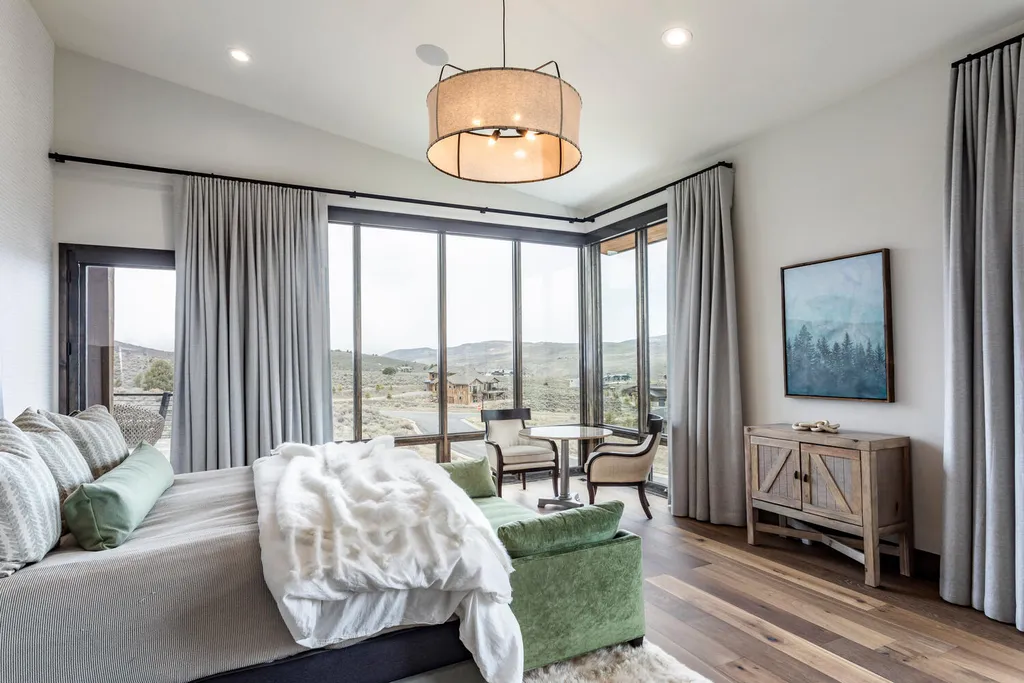 6110 E Blue Wing Loop Home in Kamas, Utah. Immerse yourself in the grandeur of Utah's natural beauty at 6110 E Blue Wing in Victory Ranch. This modern mountain home offers breathtaking 180° views of mountains, Deer Valley ski resort, and rock cliffs from every room.