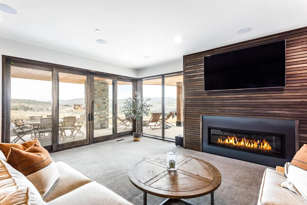 6110 E Blue Wing Loop Home in Kamas, Utah. Immerse yourself in the grandeur of Utah's natural beauty at 6110 E Blue Wing in Victory Ranch. This modern mountain home offers breathtaking 180° views of mountains, Deer Valley ski resort, and rock cliffs from every room.