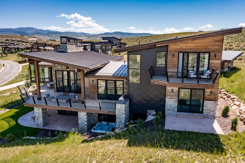 6110 E Blue Wing Loop Home in Kamas, Utah. Immerse yourself in the grandeur of Utah's natural beauty at 6110 E Blue Wing in Victory Ranch. This modern mountain home offers breathtaking 180° views of mountains, Deer Valley ski resort, and rock cliffs from every room.