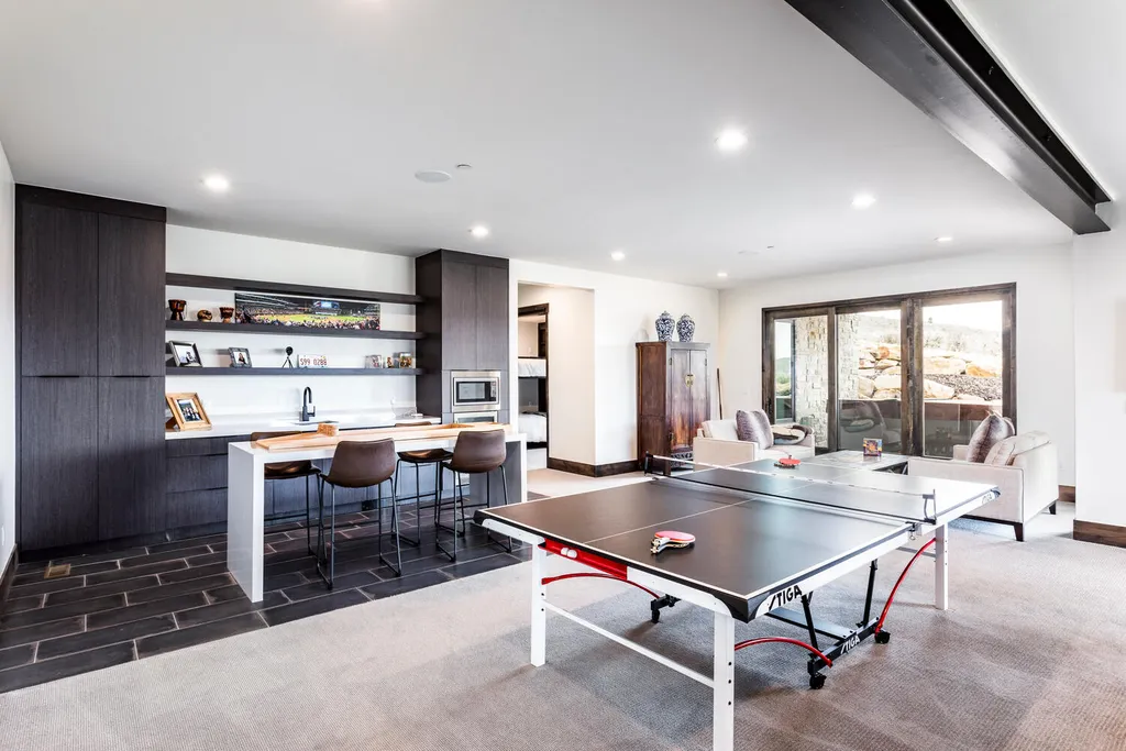 6110 E Blue Wing Loop Home in Kamas, Utah. Immerse yourself in the grandeur of Utah's natural beauty at 6110 E Blue Wing in Victory Ranch. This modern mountain home offers breathtaking 180° views of mountains, Deer Valley ski resort, and rock cliffs from every room.