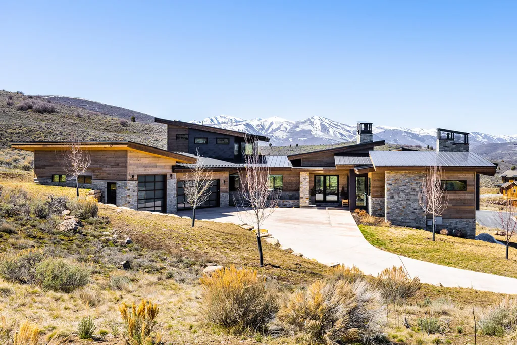 6110 E Blue Wing Loop Home in Kamas, Utah. Immerse yourself in the grandeur of Utah's natural beauty at 6110 E Blue Wing in Victory Ranch. This modern mountain home offers breathtaking 180° views of mountains, Deer Valley ski resort, and rock cliffs from every room.