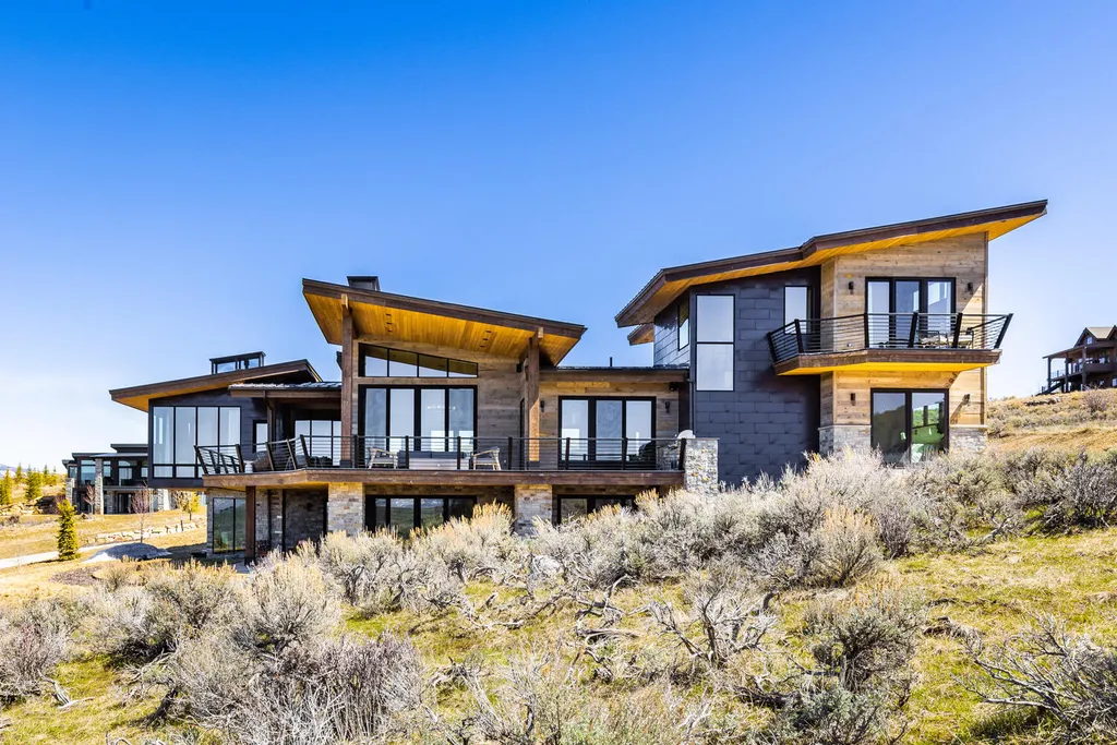 6110 E Blue Wing Loop Home in Kamas, Utah. Immerse yourself in the grandeur of Utah's natural beauty at 6110 E Blue Wing in Victory Ranch. This modern mountain home offers breathtaking 180° views of mountains, Deer Valley ski resort, and rock cliffs from every room.