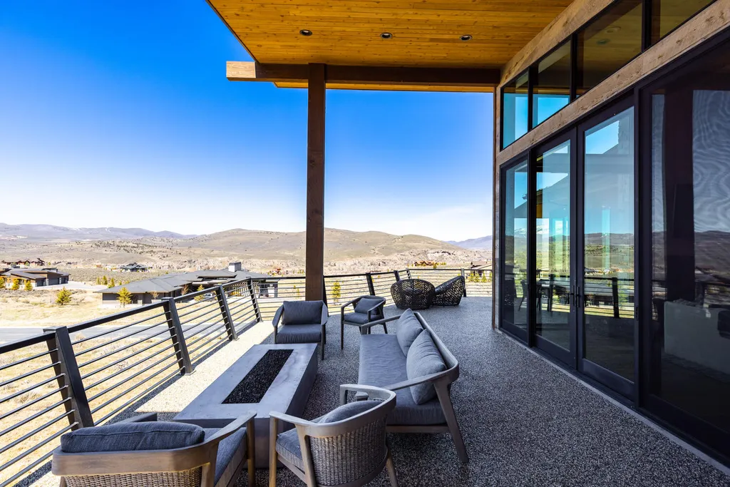6110 E Blue Wing Loop Home in Kamas, Utah. Immerse yourself in the grandeur of Utah's natural beauty at 6110 E Blue Wing in Victory Ranch. This modern mountain home offers breathtaking 180° views of mountains, Deer Valley ski resort, and rock cliffs from every room.