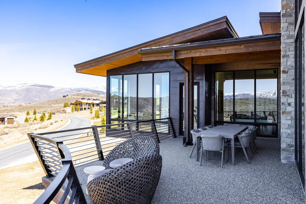 6110 E Blue Wing Loop Home in Kamas, Utah. Immerse yourself in the grandeur of Utah's natural beauty at 6110 E Blue Wing in Victory Ranch. This modern mountain home offers breathtaking 180° views of mountains, Deer Valley ski resort, and rock cliffs from every room.