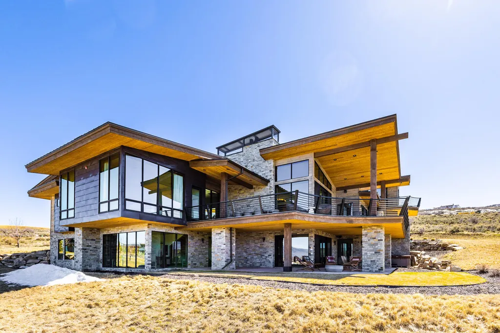 6110 E Blue Wing Loop Home in Kamas, Utah. Immerse yourself in the grandeur of Utah's natural beauty at 6110 E Blue Wing in Victory Ranch. This modern mountain home offers breathtaking 180° views of mountains, Deer Valley ski resort, and rock cliffs from every room.