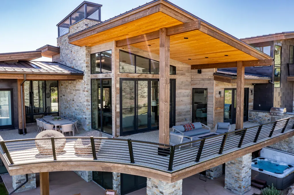 6110 E Blue Wing Loop Home in Kamas, Utah. Immerse yourself in the grandeur of Utah's natural beauty at 6110 E Blue Wing in Victory Ranch. This modern mountain home offers breathtaking 180° views of mountains, Deer Valley ski resort, and rock cliffs from every room.