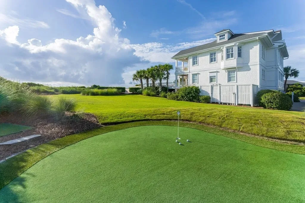 7 Cowrie Lane Home in Wrightsville Beach, North Carolina. Discover the epitome of luxurious coastal living at this expansive oceanfront estate in Wrightsville Beach. Set on nearly one acre of pristine land, this majestic property features a resort-style pool, lush landscaping, and private beach access. 