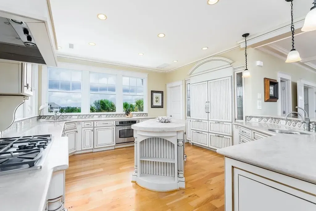 7 Cowrie Lane Home in Wrightsville Beach, North Carolina. Discover the epitome of luxurious coastal living at this expansive oceanfront estate in Wrightsville Beach. Set on nearly one acre of pristine land, this majestic property features a resort-style pool, lush landscaping, and private beach access. 