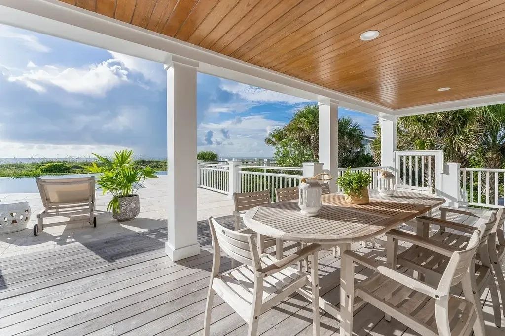 7 Cowrie Lane Home in Wrightsville Beach, North Carolina. Discover the epitome of luxurious coastal living at this expansive oceanfront estate in Wrightsville Beach. Set on nearly one acre of pristine land, this majestic property features a resort-style pool, lush landscaping, and private beach access. 