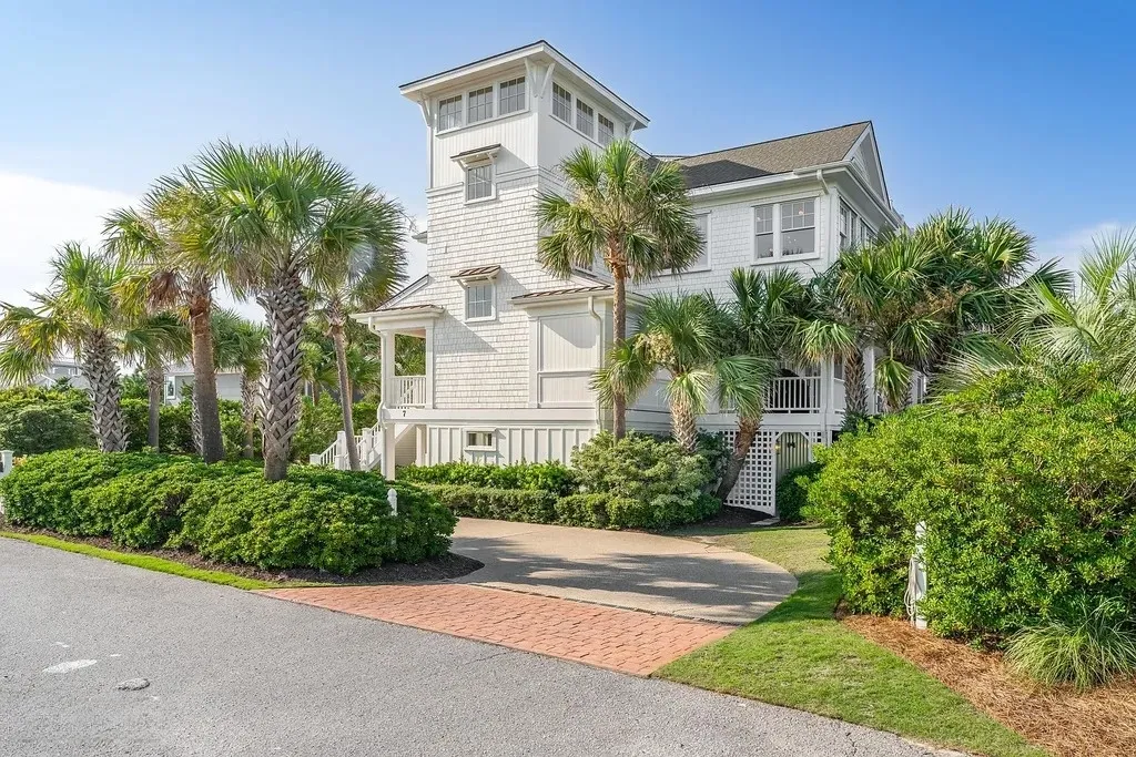 7 Cowrie Lane Home in Wrightsville Beach, North Carolina. Discover the epitome of luxurious coastal living at this expansive oceanfront estate in Wrightsville Beach. Set on nearly one acre of pristine land, this majestic property features a resort-style pool, lush landscaping, and private beach access. 