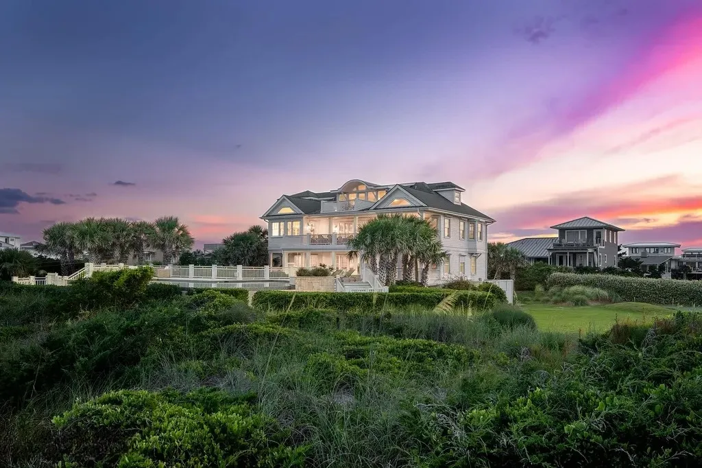 7 Cowrie Lane Home in Wrightsville Beach, North Carolina. Discover the epitome of luxurious coastal living at this expansive oceanfront estate in Wrightsville Beach. Set on nearly one acre of pristine land, this majestic property features a resort-style pool, lush landscaping, and private beach access. 