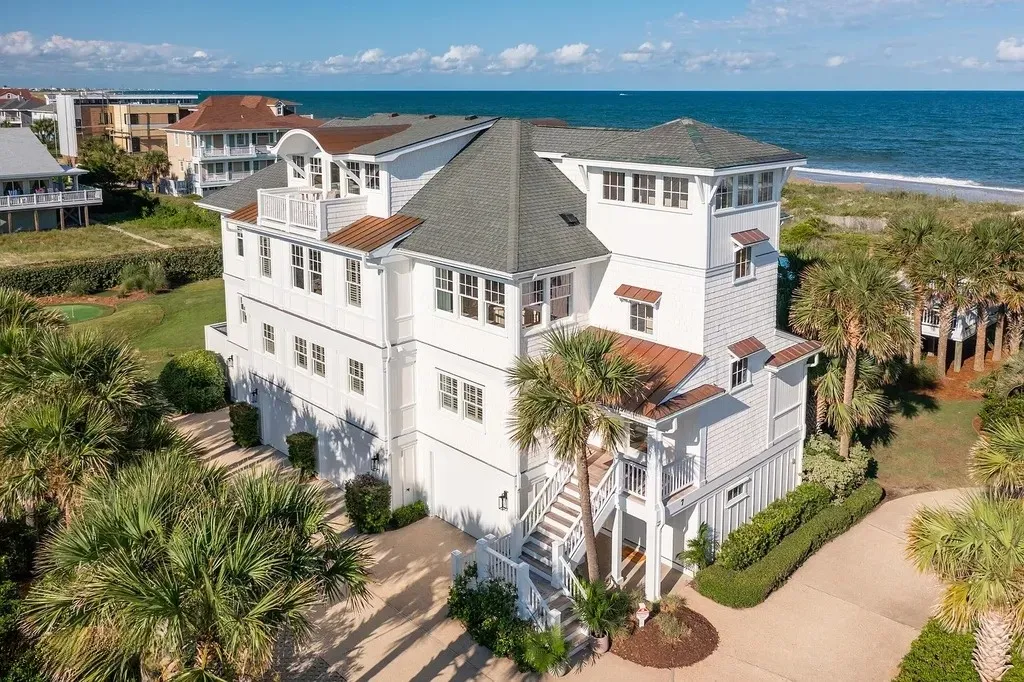 7 Cowrie Lane Home in Wrightsville Beach, North Carolina. Discover the epitome of luxurious coastal living at this expansive oceanfront estate in Wrightsville Beach. Set on nearly one acre of pristine land, this majestic property features a resort-style pool, lush landscaping, and private beach access. 