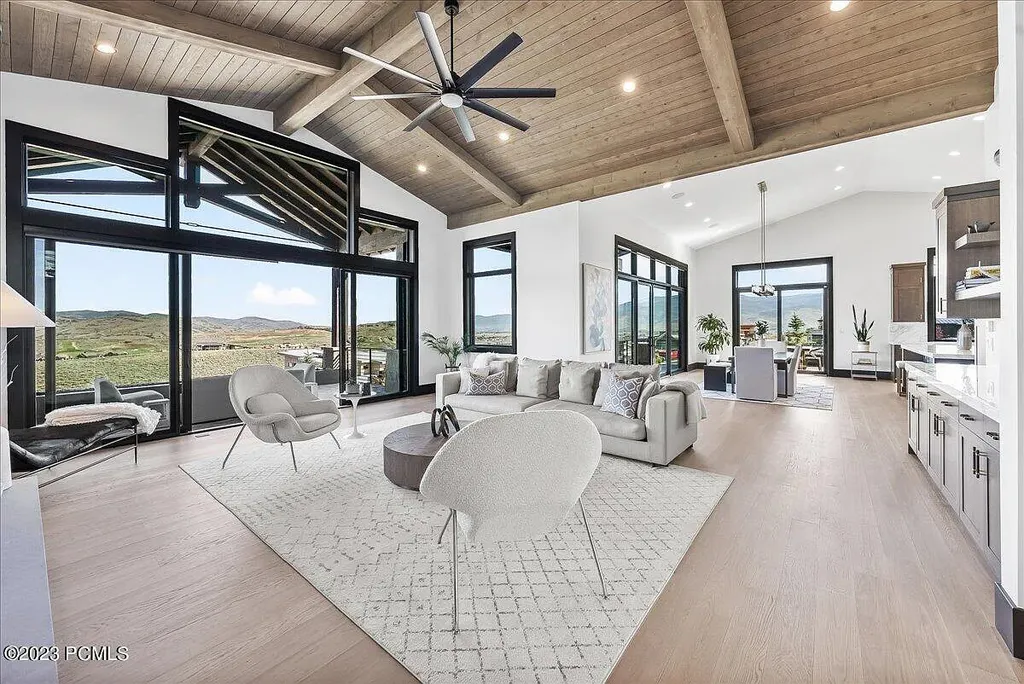 7672 East Moon Dance Circle Home in Heber, Utah. Discover the epitome of modern mountain living within the prestigious gated enclave of Victory Ranch. This unique custom home offers unparalleled views throughout the changing seasons, inviting residents to reconnect with nature and relish in top-tier amenities. Experience the perfect multigenerational mountain retreat, seamlessly blending indoor and outdoor living. With direct access to Victory Ranch's extensive backcountry trails, outdoor adventures are just steps away.