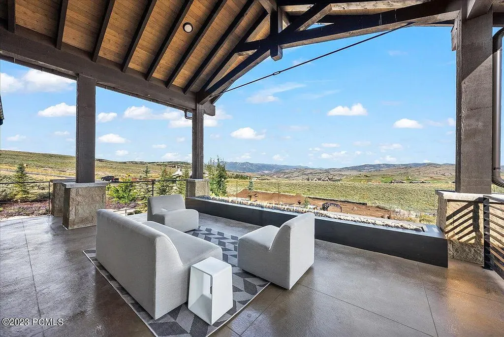 7672 East Moon Dance Circle Home in Heber, Utah. Discover the epitome of modern mountain living within the prestigious gated enclave of Victory Ranch. This unique custom home offers unparalleled views throughout the changing seasons, inviting residents to reconnect with nature and relish in top-tier amenities. Experience the perfect multigenerational mountain retreat, seamlessly blending indoor and outdoor living. With direct access to Victory Ranch's extensive backcountry trails, outdoor adventures are just steps away.