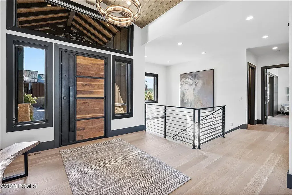 7672 East Moon Dance Circle Home in Heber, Utah. Discover the epitome of modern mountain living within the prestigious gated enclave of Victory Ranch. This unique custom home offers unparalleled views throughout the changing seasons, inviting residents to reconnect with nature and relish in top-tier amenities. Experience the perfect multigenerational mountain retreat, seamlessly blending indoor and outdoor living. With direct access to Victory Ranch's extensive backcountry trails, outdoor adventures are just steps away.