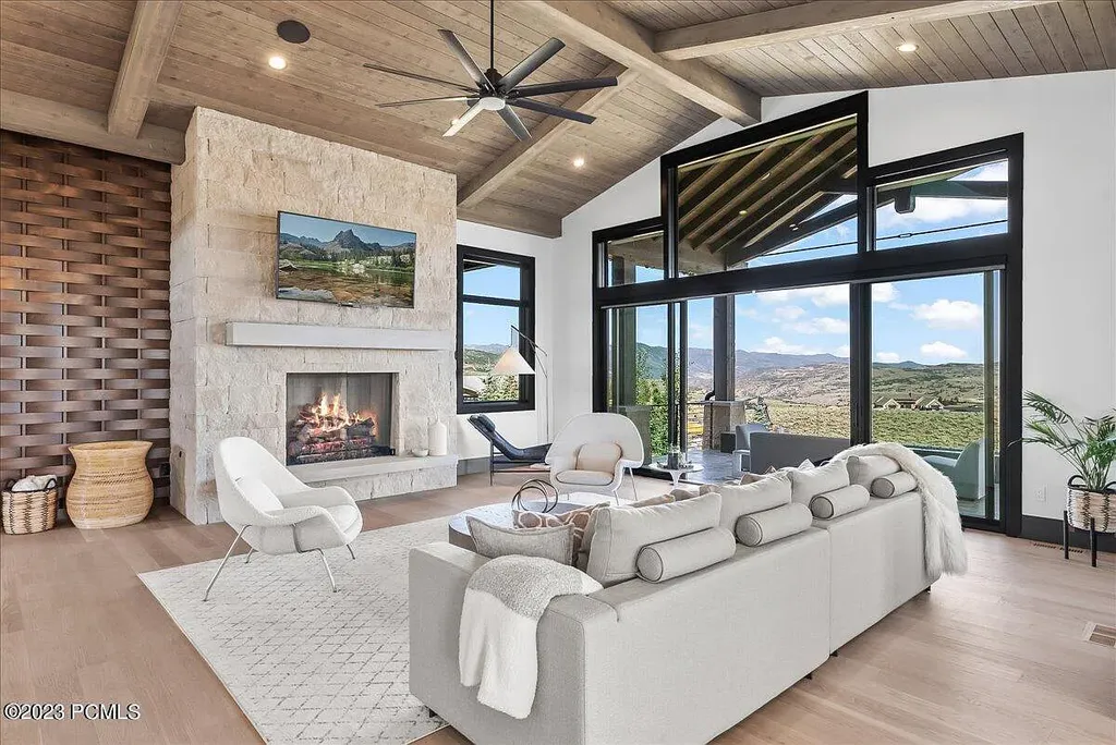 7672 East Moon Dance Circle Home in Heber, Utah. Discover the epitome of modern mountain living within the prestigious gated enclave of Victory Ranch. This unique custom home offers unparalleled views throughout the changing seasons, inviting residents to reconnect with nature and relish in top-tier amenities. Experience the perfect multigenerational mountain retreat, seamlessly blending indoor and outdoor living. With direct access to Victory Ranch's extensive backcountry trails, outdoor adventures are just steps away.