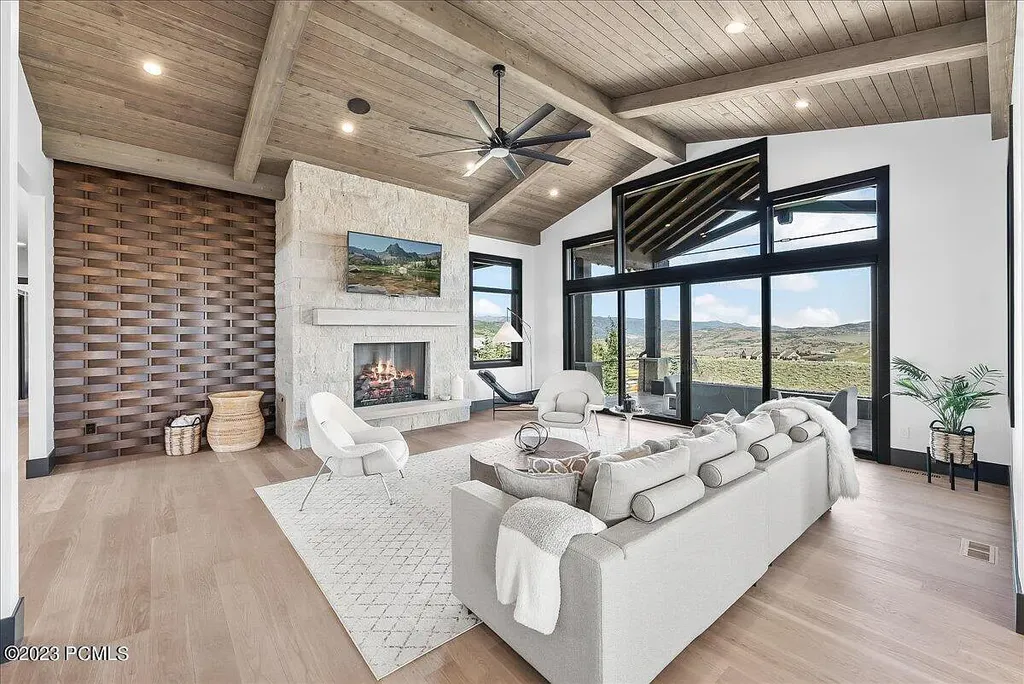 7672 East Moon Dance Circle Home in Heber, Utah. Discover the epitome of modern mountain living within the prestigious gated enclave of Victory Ranch. This unique custom home offers unparalleled views throughout the changing seasons, inviting residents to reconnect with nature and relish in top-tier amenities. Experience the perfect multigenerational mountain retreat, seamlessly blending indoor and outdoor living. With direct access to Victory Ranch's extensive backcountry trails, outdoor adventures are just steps away.