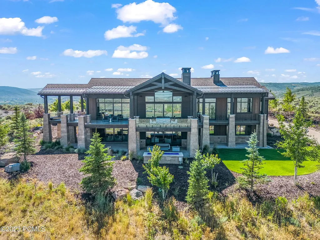 7672 East Moon Dance Circle Home in Heber, Utah. Discover the epitome of modern mountain living within the prestigious gated enclave of Victory Ranch. This unique custom home offers unparalleled views throughout the changing seasons, inviting residents to reconnect with nature and relish in top-tier amenities. Experience the perfect multigenerational mountain retreat, seamlessly blending indoor and outdoor living. With direct access to Victory Ranch's extensive backcountry trails, outdoor adventures are just steps away.