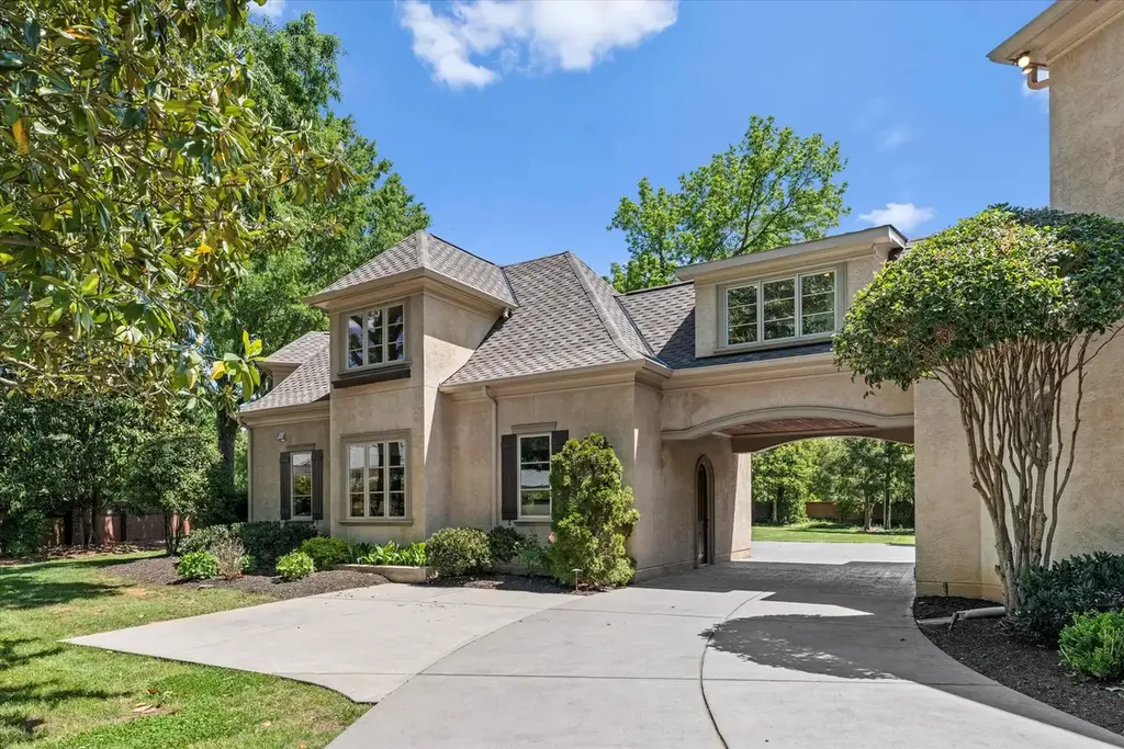 8600 Fairview Road Home in Charlotte, North Carolina. Discover the epitome of luxury living at Fairview Manor Estate in the coveted Carmel Park neighborhood. This gated 1.27-acre property boasts a stunning great room with a 2-story fireplace, exquisite millwork, and floor-to-ceiling windows. 