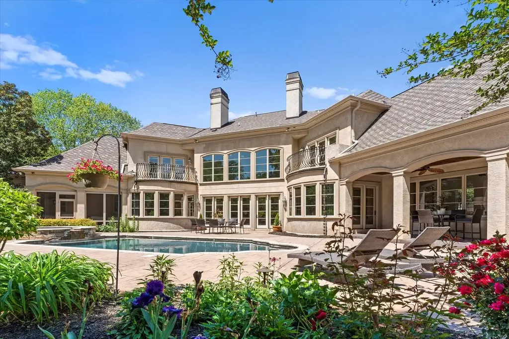 8600 Fairview Road Home in Charlotte, North Carolina. Discover the epitome of luxury living at Fairview Manor Estate in the coveted Carmel Park neighborhood. This gated 1.27-acre property boasts a stunning great room with a 2-story fireplace, exquisite millwork, and floor-to-ceiling windows. 