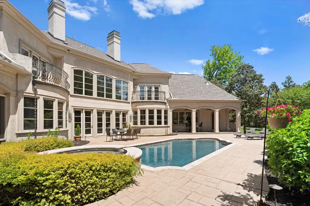 8600 Fairview Road Home in Charlotte, North Carolina. Discover the epitome of luxury living at Fairview Manor Estate in the coveted Carmel Park neighborhood. This gated 1.27-acre property boasts a stunning great room with a 2-story fireplace, exquisite millwork, and floor-to-ceiling windows. 