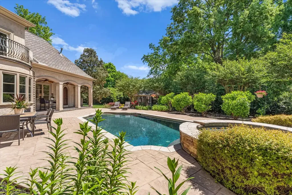 8600 Fairview Road Home in Charlotte, North Carolina. Discover the epitome of luxury living at Fairview Manor Estate in the coveted Carmel Park neighborhood. This gated 1.27-acre property boasts a stunning great room with a 2-story fireplace, exquisite millwork, and floor-to-ceiling windows. 