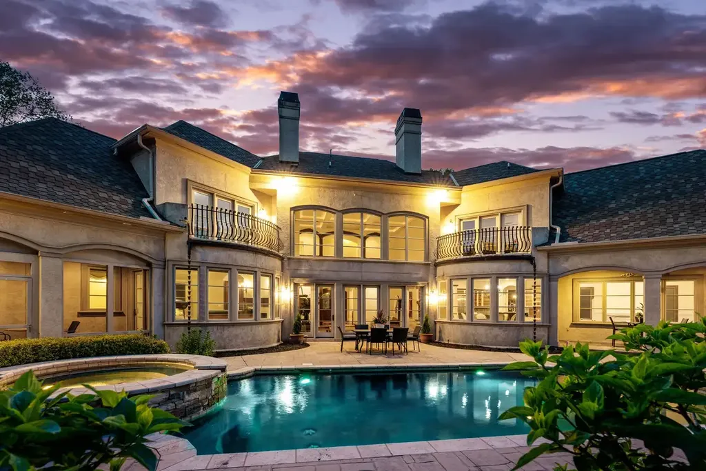 8600 Fairview Road Home in Charlotte, North Carolina. Discover the epitome of luxury living at Fairview Manor Estate in the coveted Carmel Park neighborhood. This gated 1.27-acre property boasts a stunning great room with a 2-story fireplace, exquisite millwork, and floor-to-ceiling windows. 