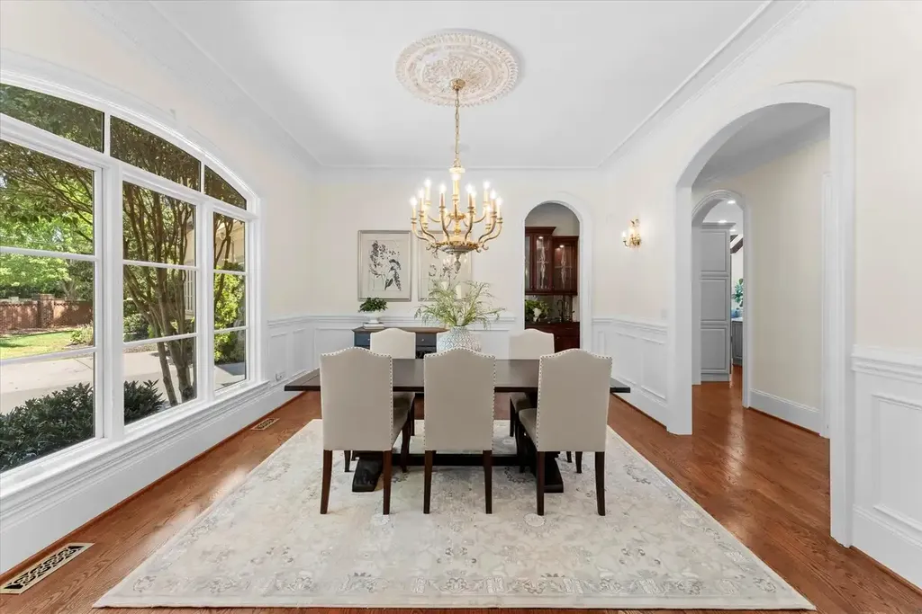 8600 Fairview Road Home in Charlotte, North Carolina. Discover the epitome of luxury living at Fairview Manor Estate in the coveted Carmel Park neighborhood. This gated 1.27-acre property boasts a stunning great room with a 2-story fireplace, exquisite millwork, and floor-to-ceiling windows. 