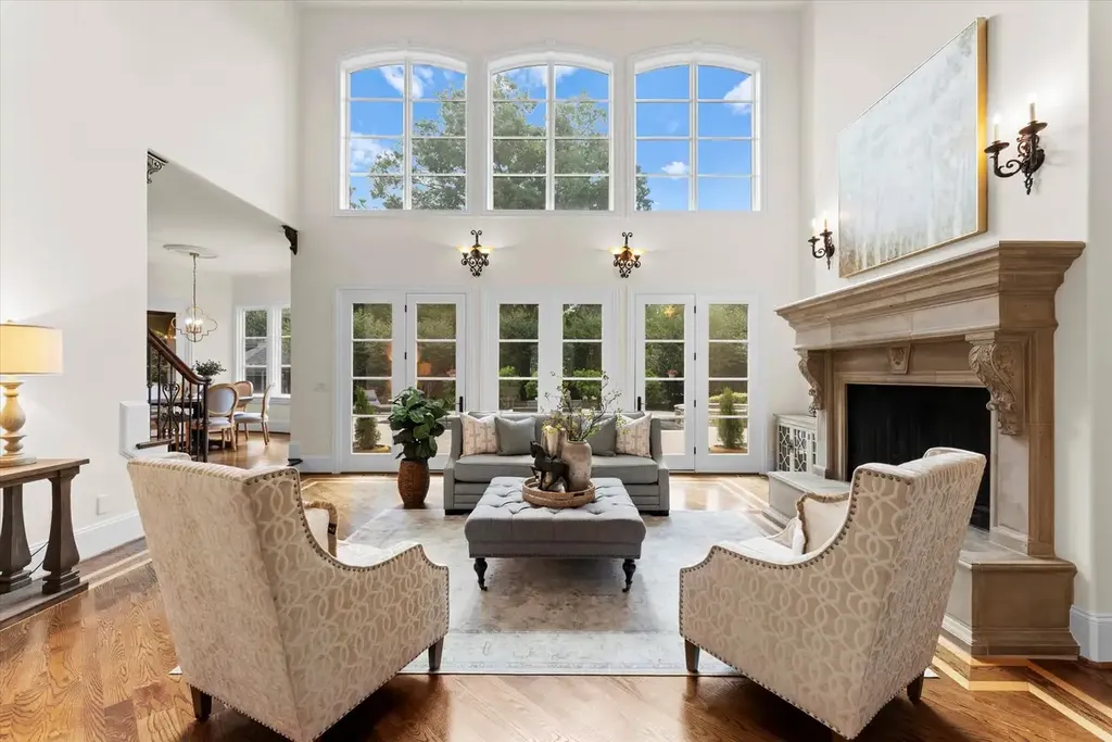 8600 Fairview Road Home in Charlotte, North Carolina. Discover the epitome of luxury living at Fairview Manor Estate in the coveted Carmel Park neighborhood. This gated 1.27-acre property boasts a stunning great room with a 2-story fireplace, exquisite millwork, and floor-to-ceiling windows. 