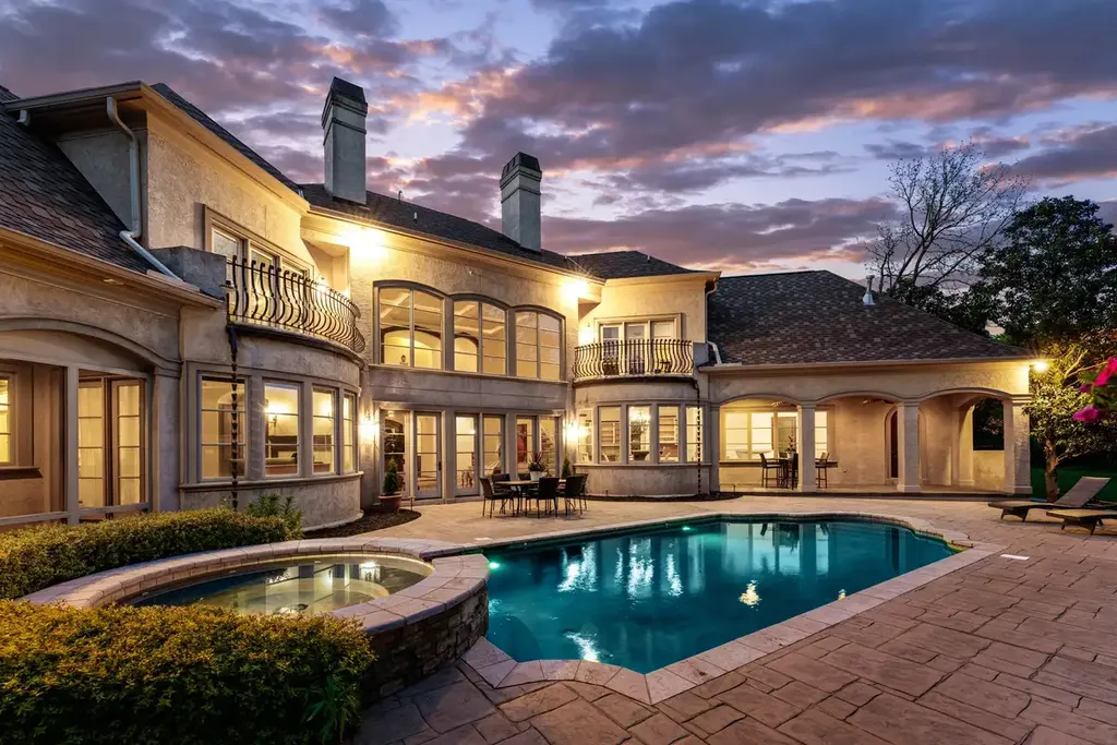 8600 Fairview Road Home in Charlotte, North Carolina. Discover the epitome of luxury living at Fairview Manor Estate in the coveted Carmel Park neighborhood. This gated 1.27-acre property boasts a stunning great room with a 2-story fireplace, exquisite millwork, and floor-to-ceiling windows. 