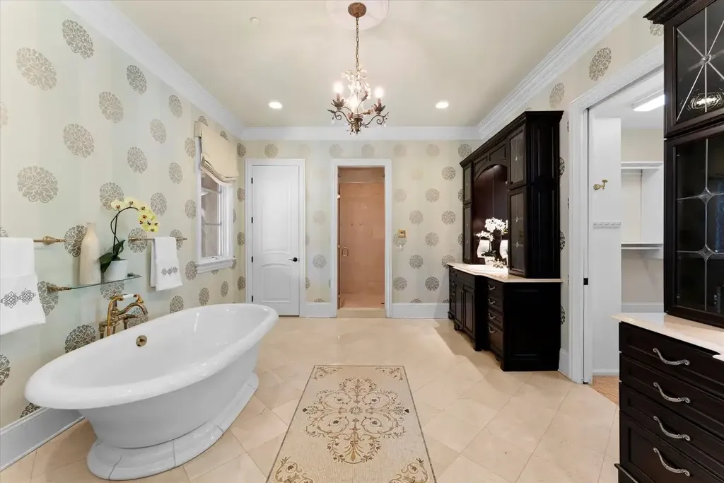 8600 Fairview Road Home in Charlotte, North Carolina. Discover the epitome of luxury living at Fairview Manor Estate in the coveted Carmel Park neighborhood. This gated 1.27-acre property boasts a stunning great room with a 2-story fireplace, exquisite millwork, and floor-to-ceiling windows. 
