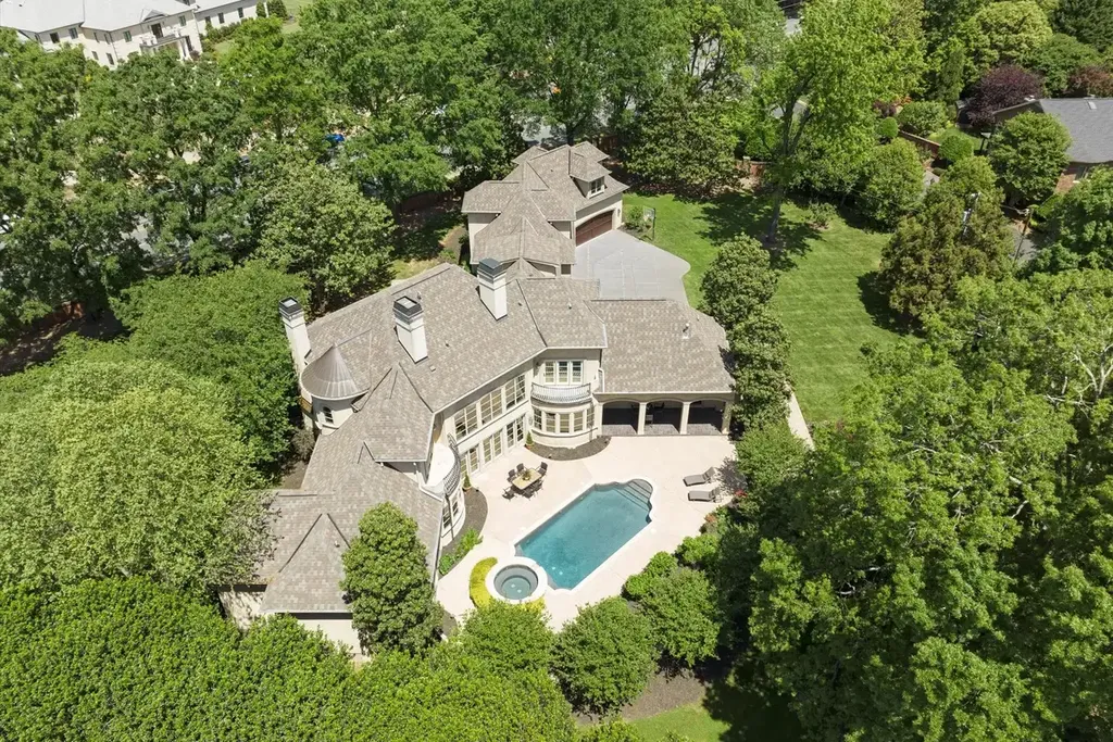 8600 Fairview Road Home in Charlotte, North Carolina. Discover the epitome of luxury living at Fairview Manor Estate in the coveted Carmel Park neighborhood. This gated 1.27-acre property boasts a stunning great room with a 2-story fireplace, exquisite millwork, and floor-to-ceiling windows. 