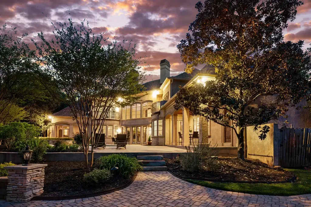 8600 Fairview Road Home in Charlotte, North Carolina. Discover the epitome of luxury living at Fairview Manor Estate in the coveted Carmel Park neighborhood. This gated 1.27-acre property boasts a stunning great room with a 2-story fireplace, exquisite millwork, and floor-to-ceiling windows. 