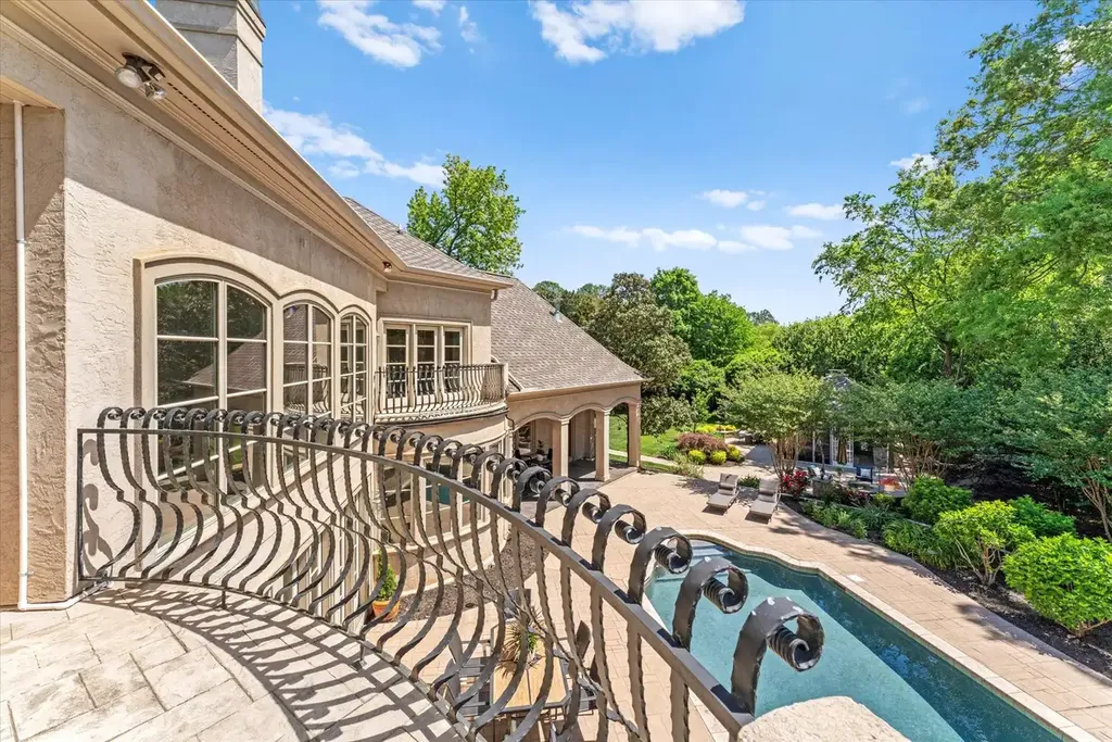 8600 Fairview Road Home in Charlotte, North Carolina. Discover the epitome of luxury living at Fairview Manor Estate in the coveted Carmel Park neighborhood. This gated 1.27-acre property boasts a stunning great room with a 2-story fireplace, exquisite millwork, and floor-to-ceiling windows. 
