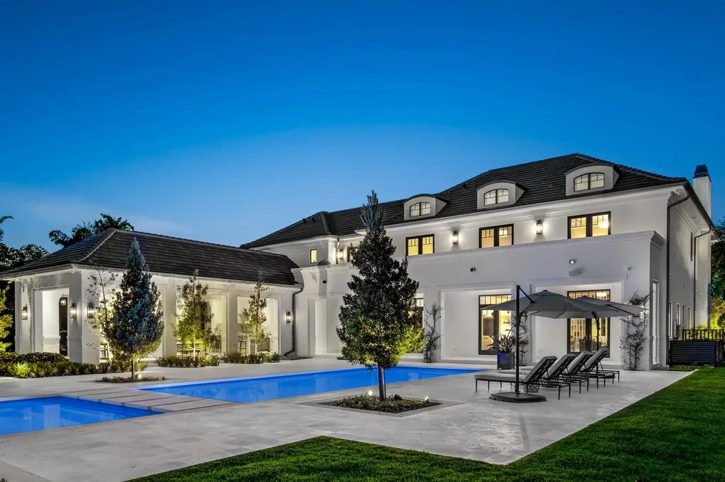 8840 SW 61st Court Home in Pinecrest, Florida. Explore this exquisite European-inspired home in N. Pinecrest, boasting 7 bedrooms and 7.5 bathrooms. From the formal living room with a wine cellar to the showstopper kitchen, this residence exudes elegance and sophistication.