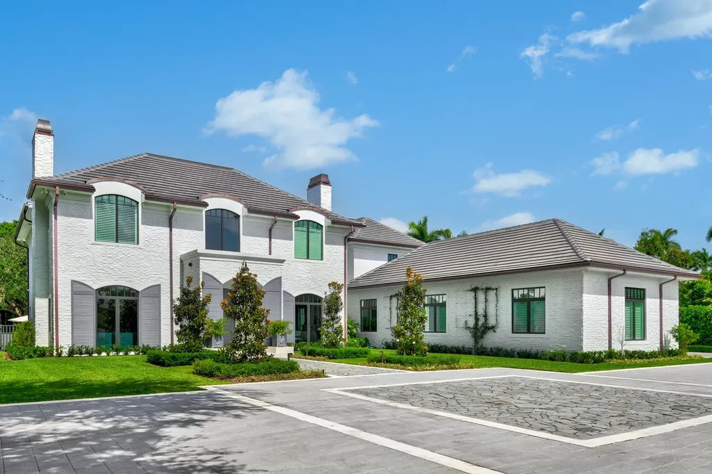8840 SW 61st Court Home in Pinecrest, Florida. Explore this exquisite European-inspired home in N. Pinecrest, boasting 7 bedrooms and 7.5 bathrooms. From the formal living room with a wine cellar to the showstopper kitchen, this residence exudes elegance and sophistication.