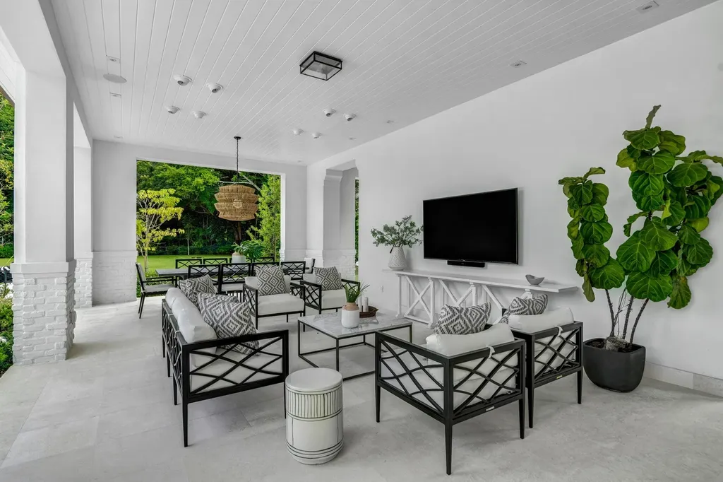 8840 SW 61st Court Home in Pinecrest, Florida. Explore this exquisite European-inspired home in N. Pinecrest, boasting 7 bedrooms and 7.5 bathrooms. From the formal living room with a wine cellar to the showstopper kitchen, this residence exudes elegance and sophistication.