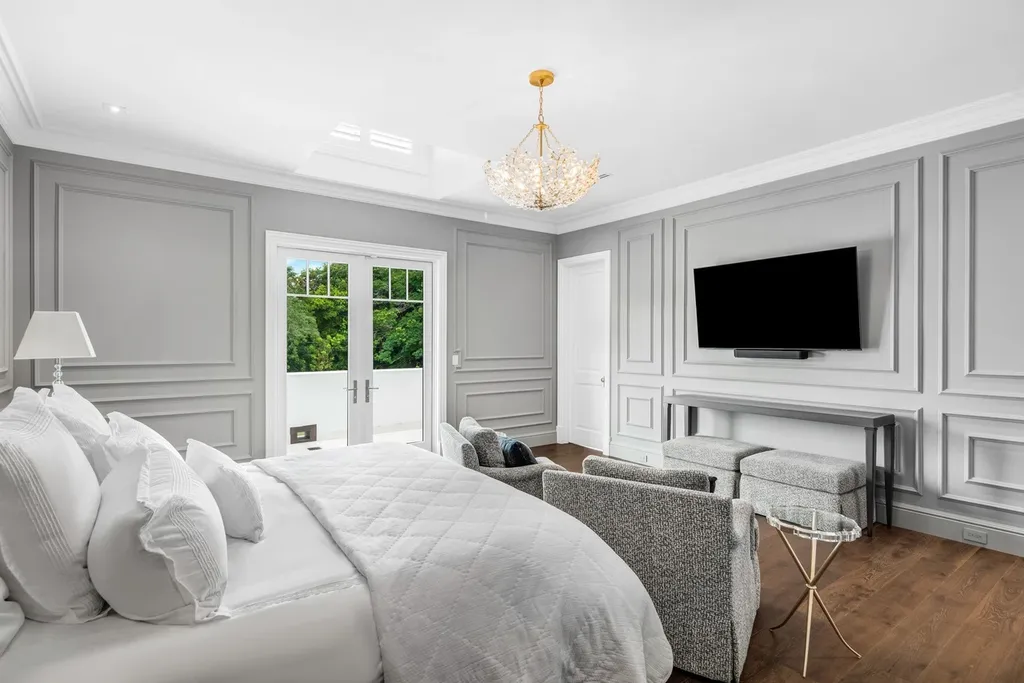 8840 SW 61st Court Home in Pinecrest, Florida. Explore this exquisite European-inspired home in N. Pinecrest, boasting 7 bedrooms and 7.5 bathrooms. From the formal living room with a wine cellar to the showstopper kitchen, this residence exudes elegance and sophistication.