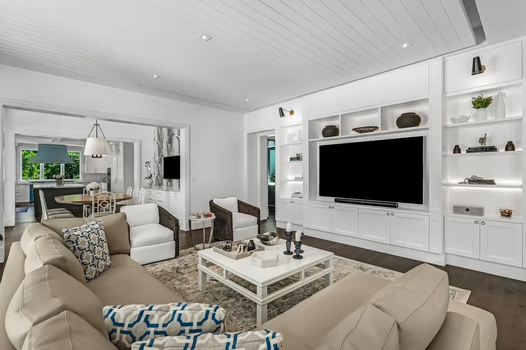 8840 SW 61st Court Home in Pinecrest, Florida. Explore this exquisite European-inspired home in N. Pinecrest, boasting 7 bedrooms and 7.5 bathrooms. From the formal living room with a wine cellar to the showstopper kitchen, this residence exudes elegance and sophistication.