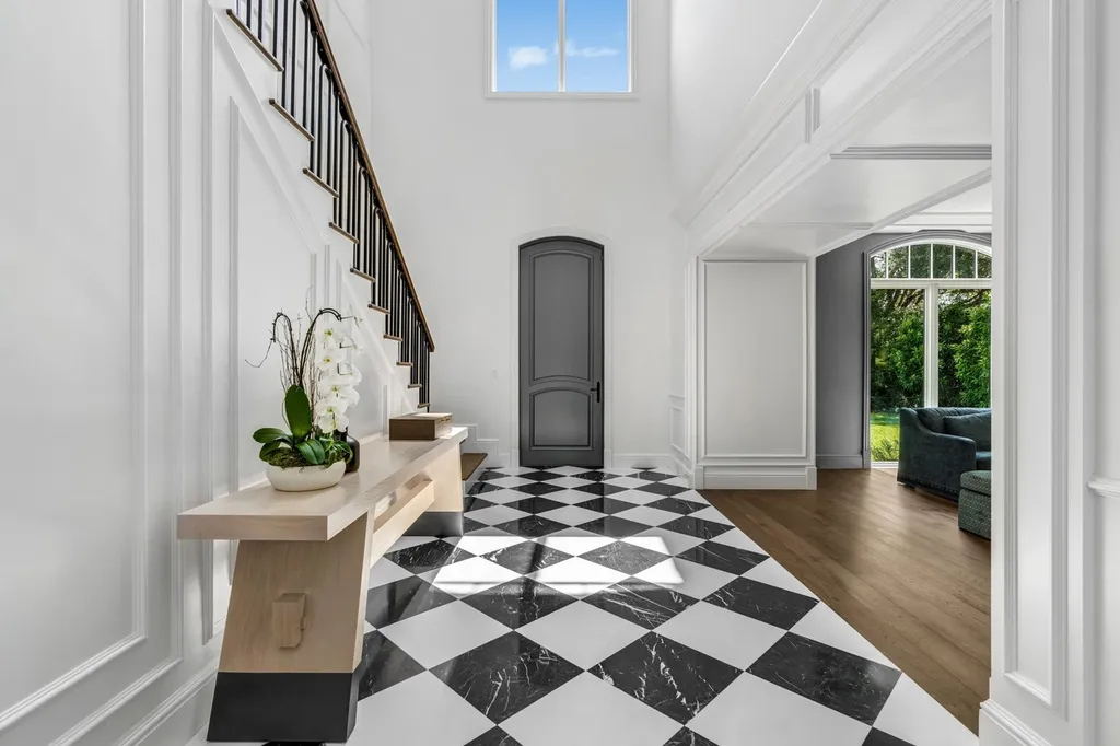8840 SW 61st Court Home in Pinecrest, Florida. Explore this exquisite European-inspired home in N. Pinecrest, boasting 7 bedrooms and 7.5 bathrooms. From the formal living room with a wine cellar to the showstopper kitchen, this residence exudes elegance and sophistication.