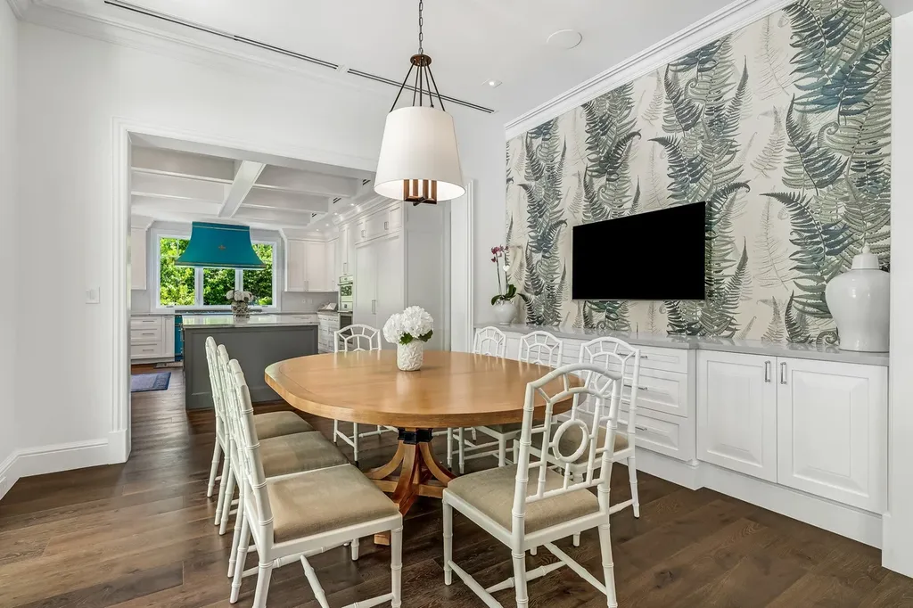 8840 SW 61st Court Home in Pinecrest, Florida. Explore this exquisite European-inspired home in N. Pinecrest, boasting 7 bedrooms and 7.5 bathrooms. From the formal living room with a wine cellar to the showstopper kitchen, this residence exudes elegance and sophistication.