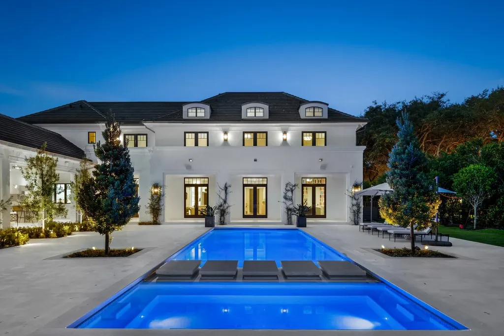 8840 SW 61st Court Home in Pinecrest, Florida. Explore this exquisite European-inspired home in N. Pinecrest, boasting 7 bedrooms and 7.5 bathrooms. From the formal living room with a wine cellar to the showstopper kitchen, this residence exudes elegance and sophistication.