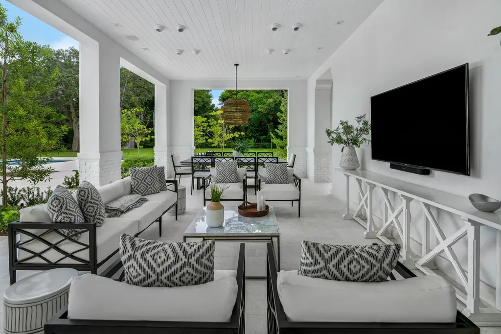 8840 SW 61st Court Home in Pinecrest, Florida. Explore this exquisite European-inspired home in N. Pinecrest, boasting 7 bedrooms and 7.5 bathrooms. From the formal living room with a wine cellar to the showstopper kitchen, this residence exudes elegance and sophistication.