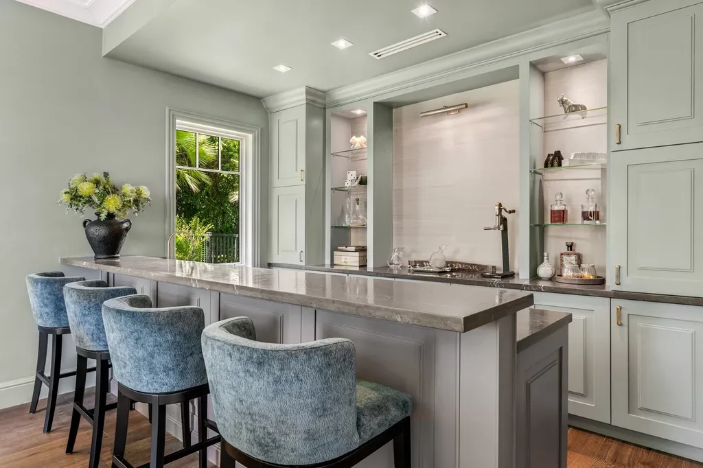 8840 SW 61st Court Home in Pinecrest, Florida. Explore this exquisite European-inspired home in N. Pinecrest, boasting 7 bedrooms and 7.5 bathrooms. From the formal living room with a wine cellar to the showstopper kitchen, this residence exudes elegance and sophistication.
