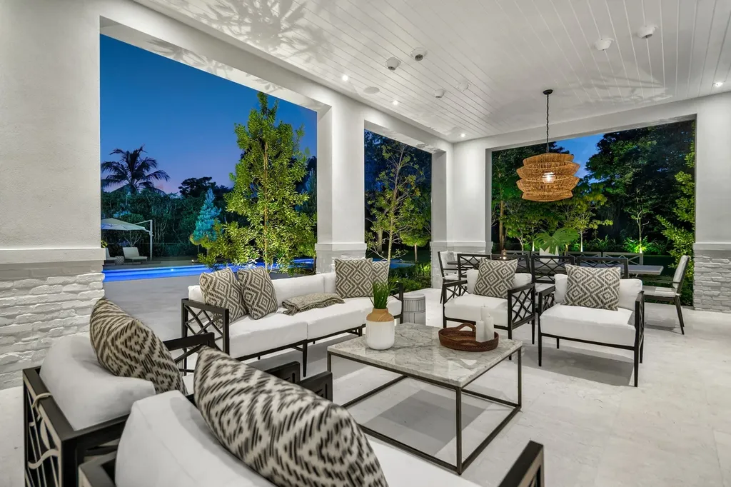 8840 SW 61st Court Home in Pinecrest, Florida. Explore this exquisite European-inspired home in N. Pinecrest, boasting 7 bedrooms and 7.5 bathrooms. From the formal living room with a wine cellar to the showstopper kitchen, this residence exudes elegance and sophistication.