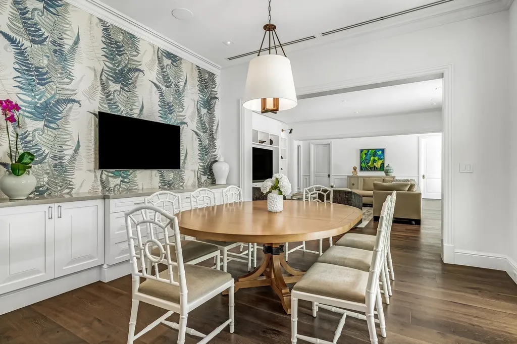 8840 SW 61st Court Home in Pinecrest, Florida. Explore this exquisite European-inspired home in N. Pinecrest, boasting 7 bedrooms and 7.5 bathrooms. From the formal living room with a wine cellar to the showstopper kitchen, this residence exudes elegance and sophistication.