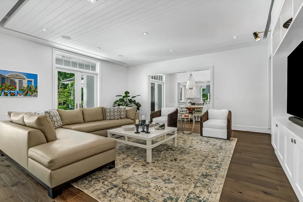8840 SW 61st Court Home in Pinecrest, Florida. Explore this exquisite European-inspired home in N. Pinecrest, boasting 7 bedrooms and 7.5 bathrooms. From the formal living room with a wine cellar to the showstopper kitchen, this residence exudes elegance and sophistication.
